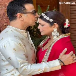 Ronit Roy With his wife in wedding dress and doing kiss on her forehead.