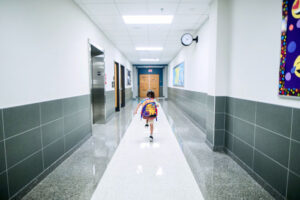 A-child-walking-school-corridor