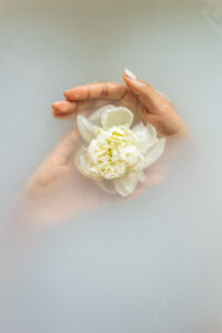 hands-in-cold-water-holds-flower-in-hand