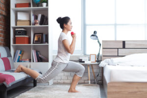 Lady doing calming exercise in bedroom to encourage faster sleep.